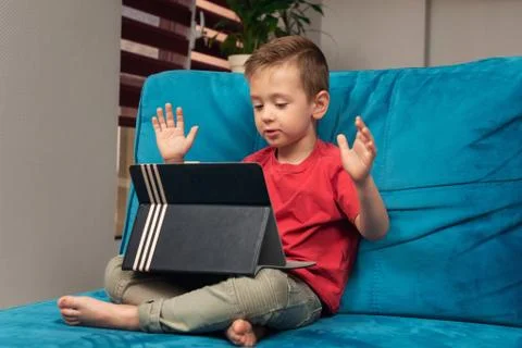 A little kid communicates using tablet Stock Photos