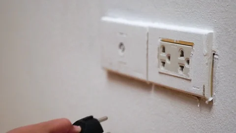 Little kid hand plug Stock Footage 89753674