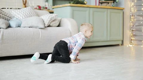 Little kid having fun at home. Slow motion. Stock Footage 140156614