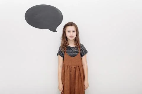 Little kid over white wall depressed and worry for distress, crying angry and Stock Photos