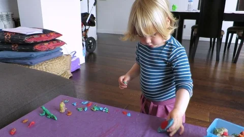 Little kid playing with plasticine Stock Footage 70607065