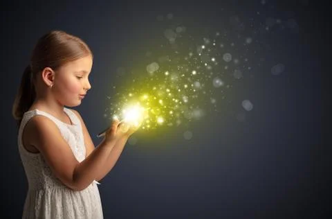 Little kid playing on sparkling tablet Stock Photos