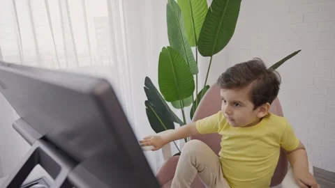 Little kid preparing for online learning distance education lesson Stock Footage 246130948