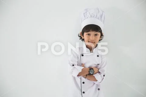 Little kid profession uniform pretending to be a chef Stock Photos