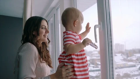 Little kid standing on a windowsill Stock-Footage 70135534