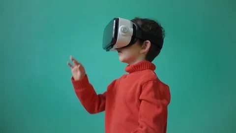 Little kid using virtual reality glasses Stock Footage 104925622