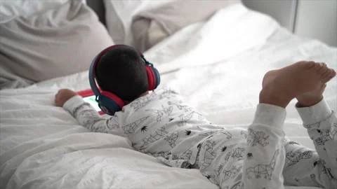 A little kid watching on a tablet Stock Footage 258678813