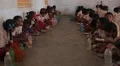 Little kids eating at school in India HD Footage