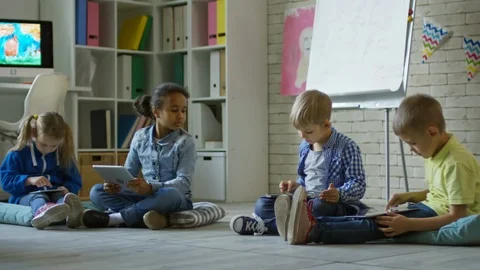 Little Kids Using Digital Tablets in Kin... | Stock Video | Pond5