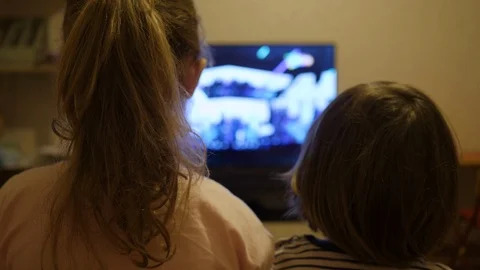 Little Kids While Watching TV. Children Watch Television on Living Room. Conc Stock Footage