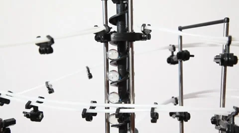 Little marbles lifting up inside run machine Video stock 8510121