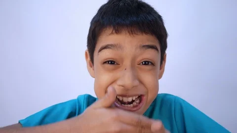 Little mix rate boy making fun face in many emotions Stockbeeldmateriaal 102411772