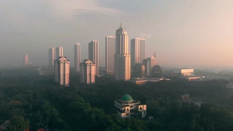 Little mosque between skyscrapers Stock Footage 134001587