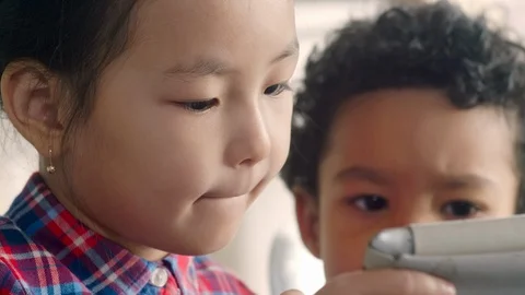 Little Multiethnic Friends Using Digital Tablet 스톡 동영상 101036965