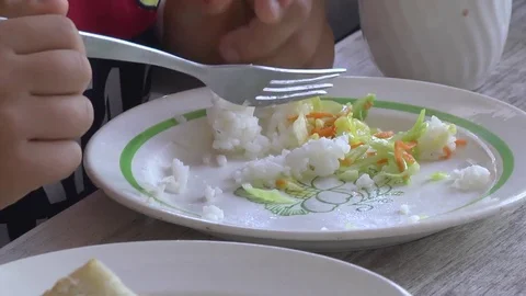 The little one eats vegetarian food Video stock 76431086
