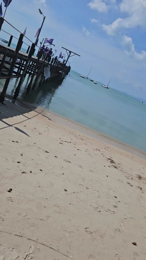 Little pier on the beach Stockbeeldmateriaal 319348450