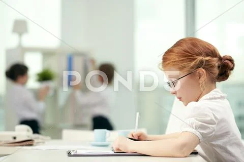 Little preschooler in glasses studying Stock Photos