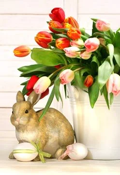 Little rabbit behind white container Stock Photos