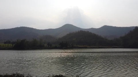 The little river flows over forest and mountain on the background at sunset Stock Footage 103691051