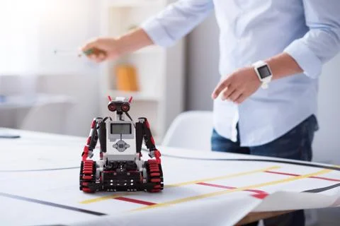 Little robot getting ready to work 库存照片