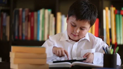 Little school boy using digital tablet Stock Footage 46025511