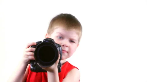 Little serios boy with a camera Stock Footage 37204315