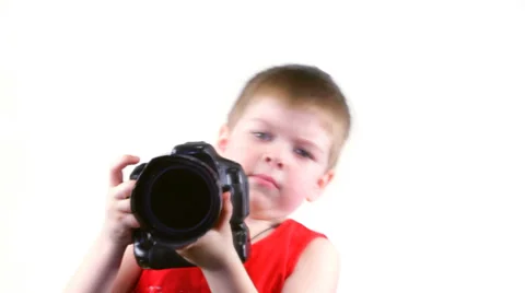 Little serios boy with a camera Stock Footage 37204319