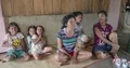 Little shy girls kids and women talking in simple Indonesian village house 4k or 4k+ Resolution