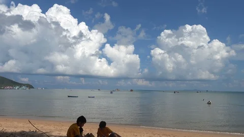 Little sibling boy playing sand on the beach summer time Stock-Footage 89754816