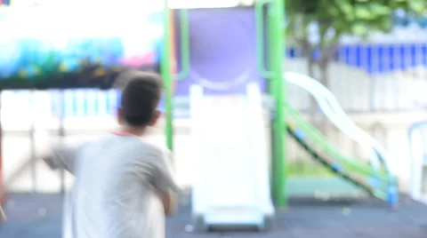 Little sibling boy playing slider with happy face smiling Stockbeeldmateriaal 65823237