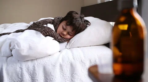 Little sick boy sleeping in bed Stock Footage 46317231