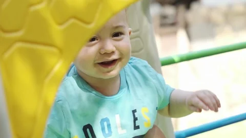 Little smiling boy playing with his mom on the playground Stock Footage 255890834
