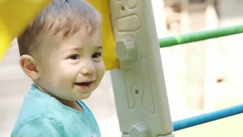 Little smiling boy playing with his mom on the playground Stock Footage 270551758