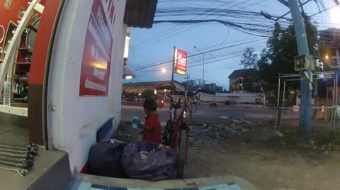 Little thai boy throw the trash in to the trash basket Stock Footage 35998547