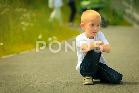 Little thoughtful boy child portrait outdoor Stock Photos