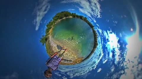 Little Tiny Planet 360 Degree Man Standing at Sea Looking at Rippling Water Stock Footage 67853849