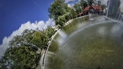 Little Tiny Planet 360 Degree Fountain Park Blue Sky Fading to Gray Rainy Video stock 71504307