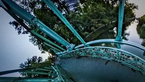 Little Tiny Planet 360 Degree Green Bridge Encircles Park-Planet Evening Lights Video stock 71507102