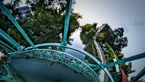 Little Tiny Planet 360 Degree Green Bridge Summer Park People Are Walking Over Video stock 72038409