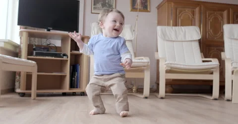 Little toddler having fun learning to stand Stock Footage 50143356
