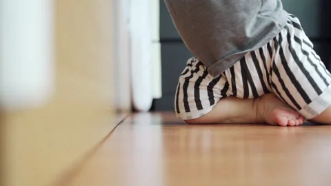 Little toddler learning to stand Stock Footage 200056387