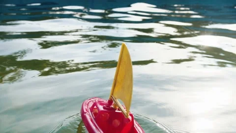 A little toy ship sailing in the pool Stock Footage 136363073