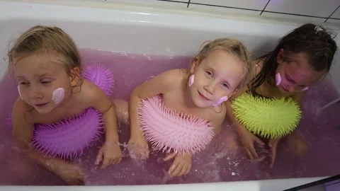 Little triplet sisters bathe in a tub Stock Video Pond5