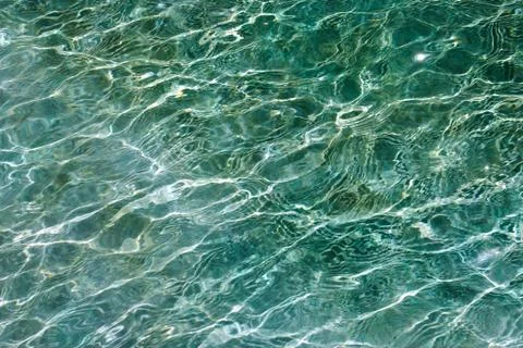 Little undulations or waves on the surface of a swimming pool Stock Photos