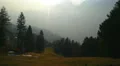 Little village in mountain valley on sunny spring day. Magnificent landscape 4k or 4k+ Resolution