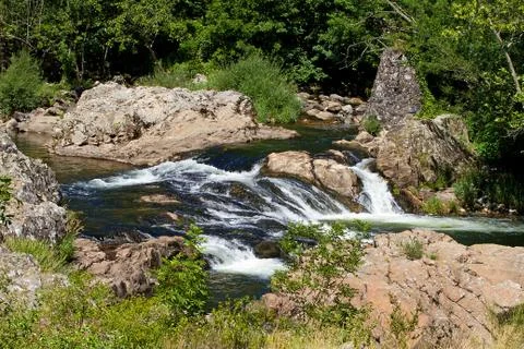 Little waterfall in the river Stock Photos