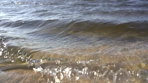 Little waves at the beach slo mo Video stock 163558368