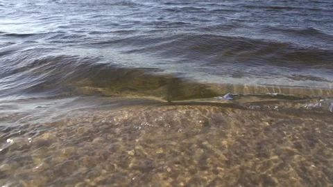 Little waves at the beach slo mo Video stock 163558374