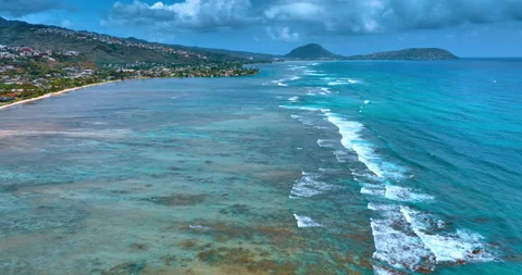 Little waves with white foam slowly roll to the shore of the Pacific Ocean. Stock Footage 306069217
