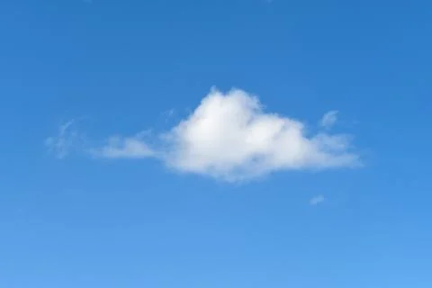 Little white cloud in blue sky Stock Photos